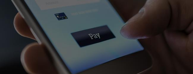 Realtime payments | close up of person paying bill on phone